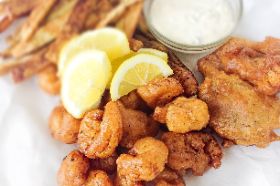 a mouthwatering feast featuring crispy fried jumbo shrimp, golden-fried catfish, and a side of perfectly seasoned fries. This is not just a meal; it's a seafood sensation that takes your taste buds on a flavorful journey